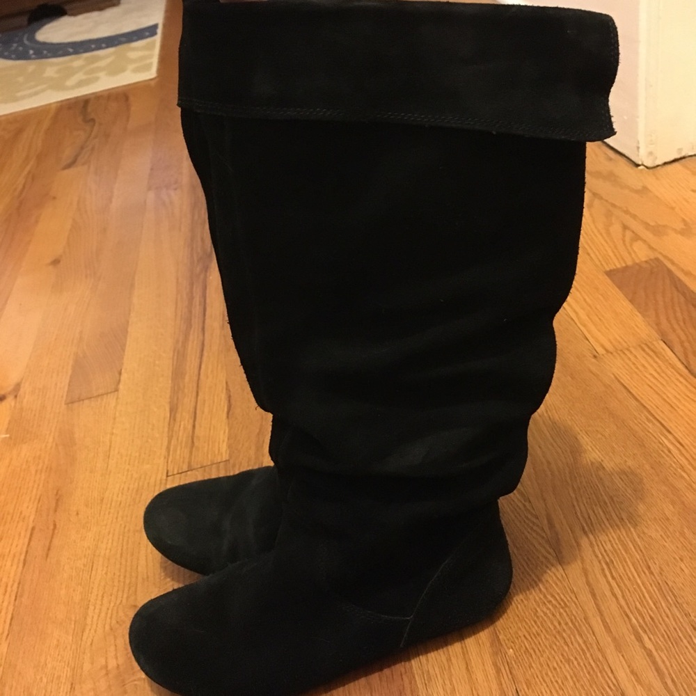 Steve Madden black suede flat boots.